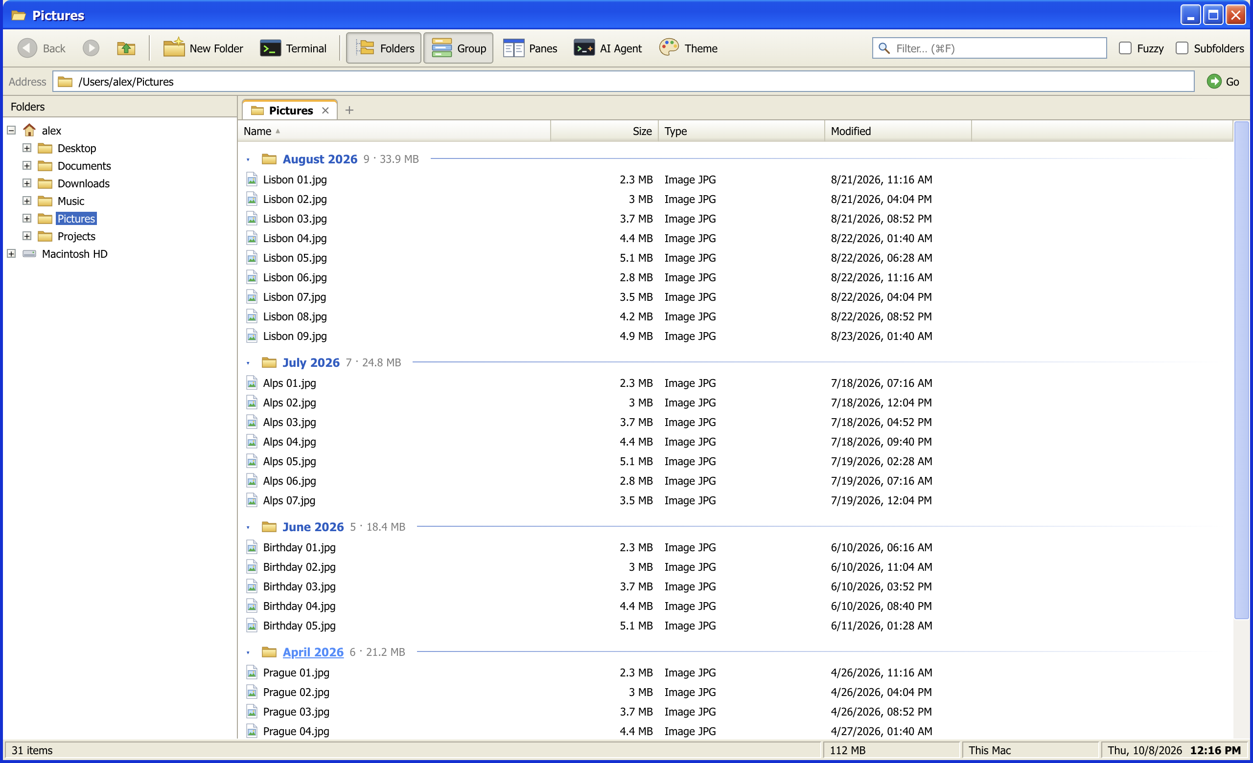 Pictures grouped by month, with the folder tree on the left